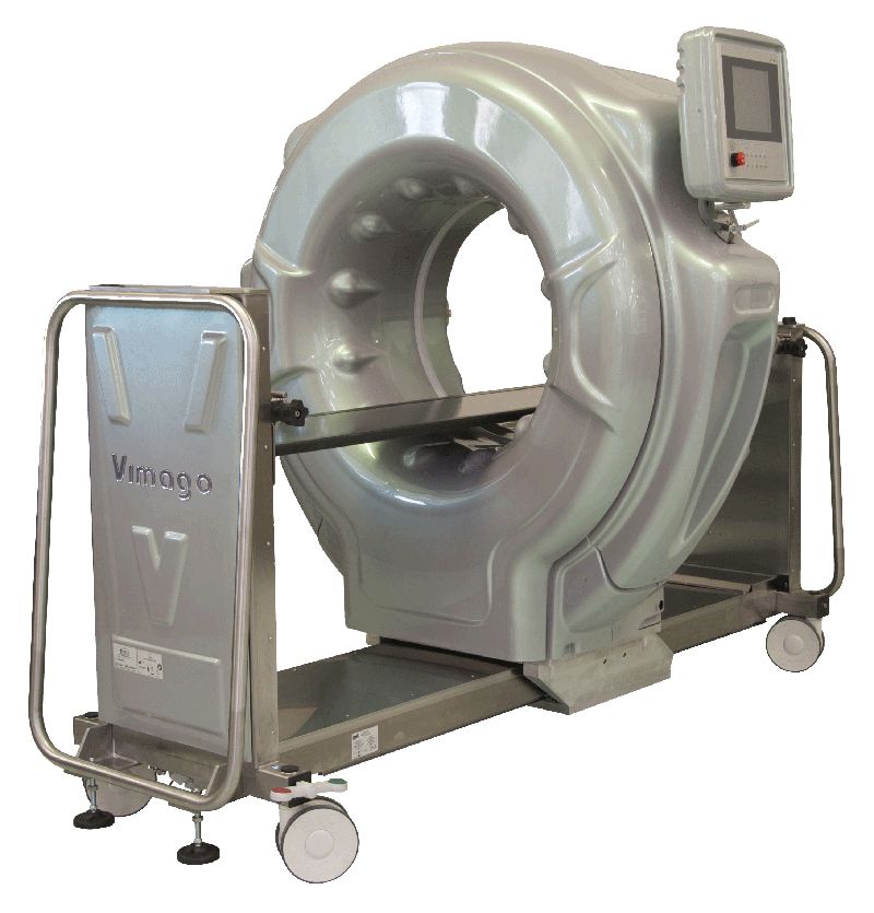 Large, metallic veterinary CT scanner with a circular opening and attached display screen.